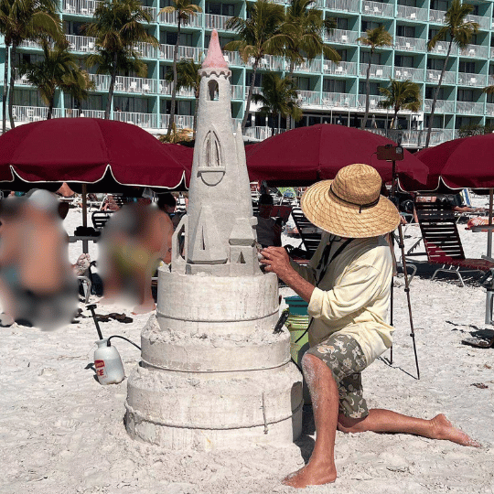 50 Summer Bucket List Ideas For The Best Summer Yet! - Man making a sandcastle