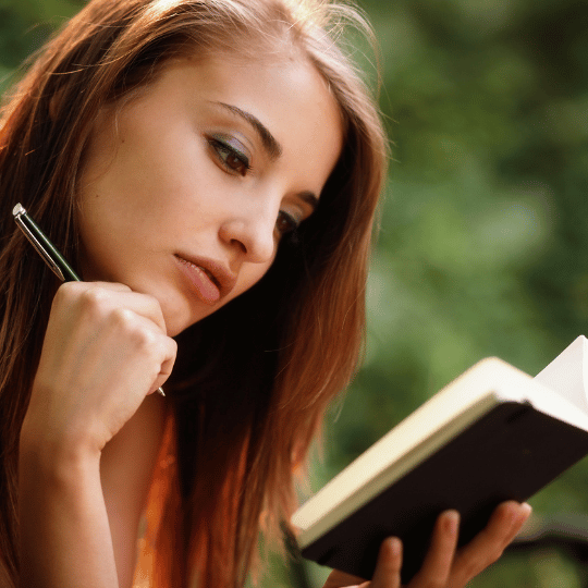 Empower Yourself: The Ultimate Book List For Women Over 40 | Woman reading a book