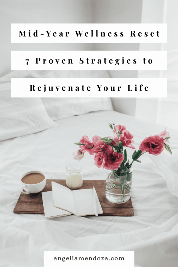 Open journal, coffee mug, candle, and vase of pink flowers resting on a tray atop a white bed, with text overlay: “Mid-Year Wellness Reset – 7 Proven Strategies to Rejuvenate Your Life”. | Angelia Mendoza