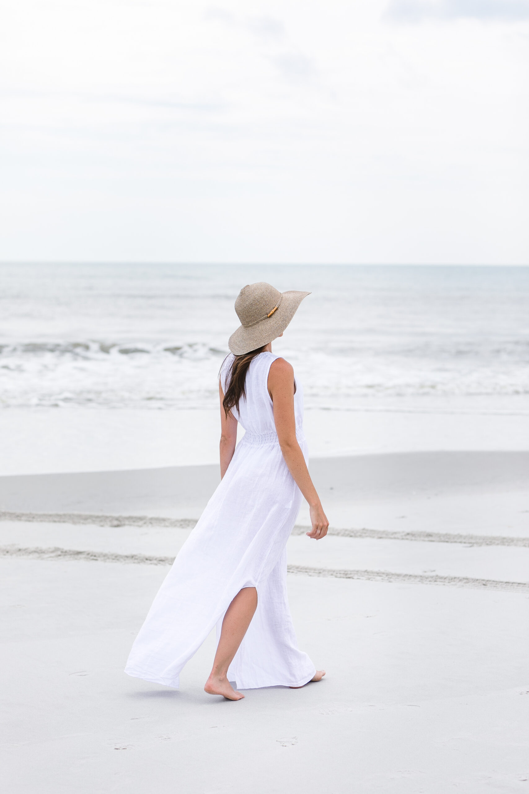 Healing with Angelia - Woman walking on the beach