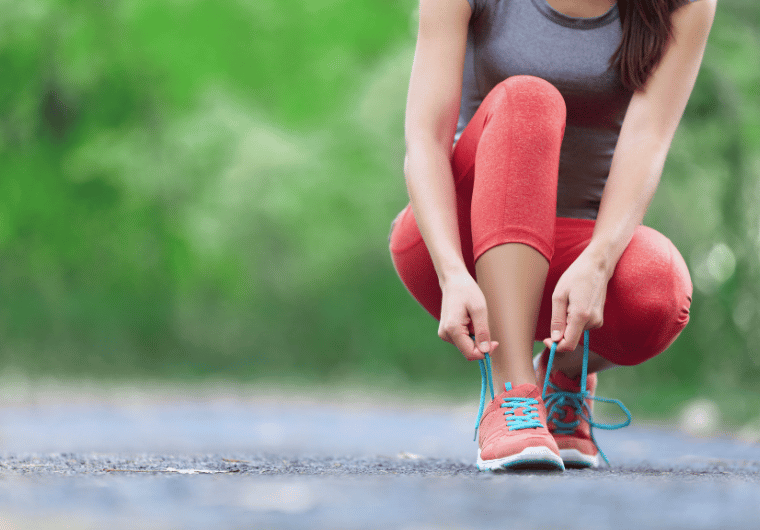 Woman running on a dirt trail in nature wearing athletic gear, promoting a free 8‑Week Beginner Running Plan. Motivational image for new runners seeking a gentle run/walk schedule to build endurance, confidence, and energy while starting their fitness journey | Angelia Mendoza