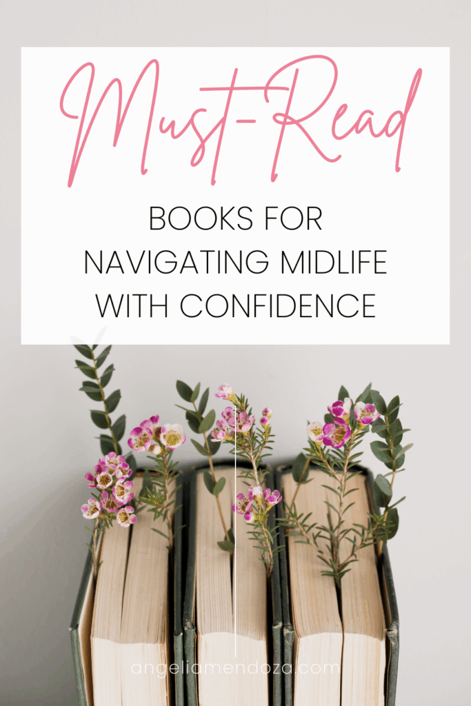 Stack of books decorated with pink flowers and text overlay that says Must-Read Books for Navigating Midlife with Confidence — featuring self-help books for women